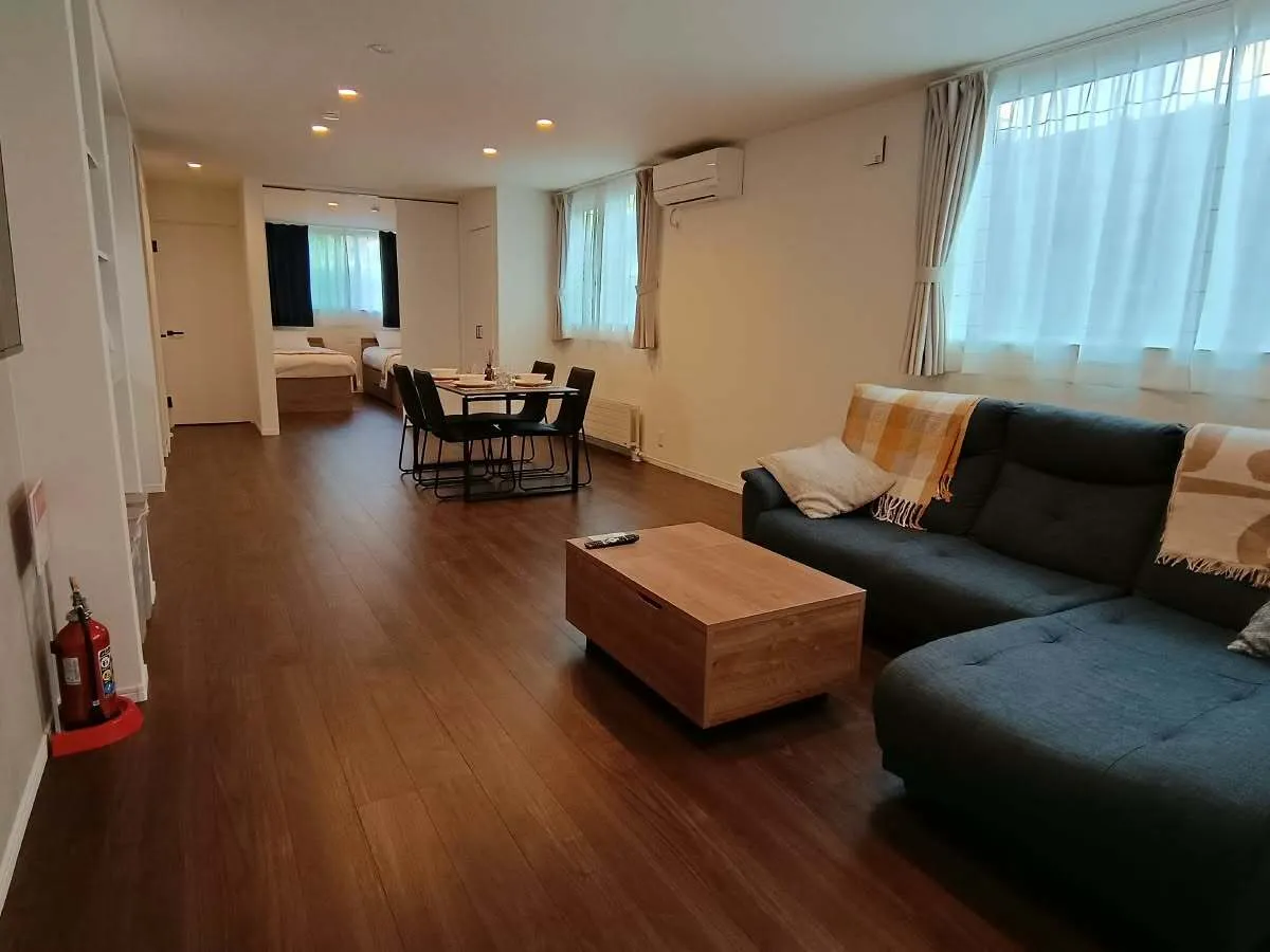Living room with corner sofa and dining table